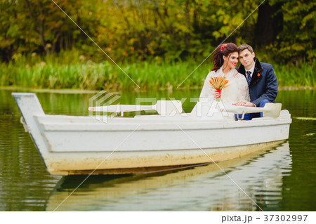 Couple newlyweds in the white boat 37302997