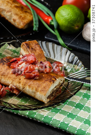 Mexican chimichanga with salsa dip 37308741