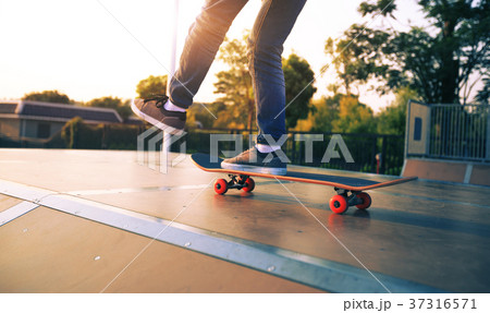 skateboarder legs skateboarding on skatepark ramp 37316571
