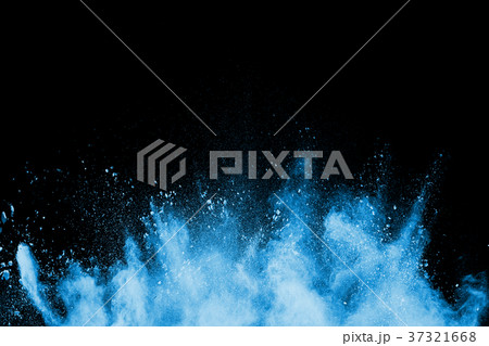 Freeze motion explosion of blue dust on a black  37321668