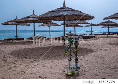 Two shisha hookahs on the sandy beach of Red Sea Two shisha hookahs on the sandy beach of Red Sea 37323779