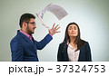 Businessman is going to throw the papers in a 37324753