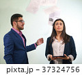 Boss is throwing the papers in a girl office 37324756