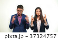 Business partners crossed their fingers and closed 37324757