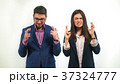 Guy and a girl in business suits crossed their 37324777