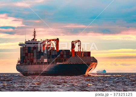 Blue container ship underway Blue container ship underway 37325125