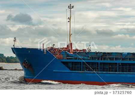Blue cargo ship underway Blue cargo ship underway 37325760