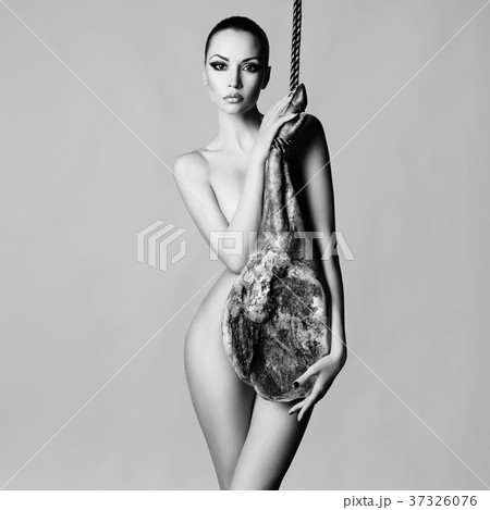 Nude elegant woman with Iberian jamon Nude elegant woman with Iberian jamon 37326076