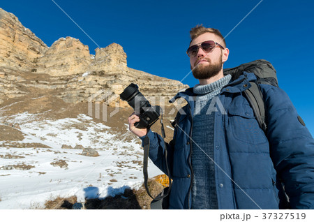 Portrait A bearded hipster photographer with a 37327519