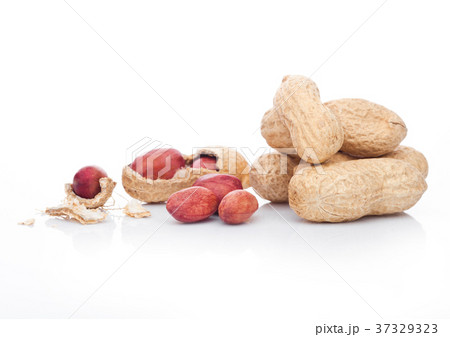 Raw peanuts with shell on white background Raw peanuts with shell on white background 37329323