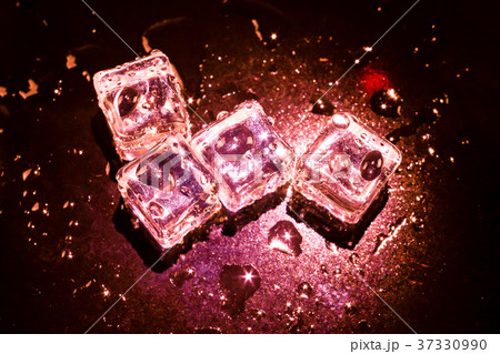 Red ice cubes and water drop background. 37330990