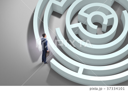 Businessman is trying to escape from maze Businessman is trying to escape from maze 37334101