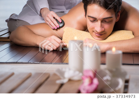 Young handsome man during spa procedure 37334973