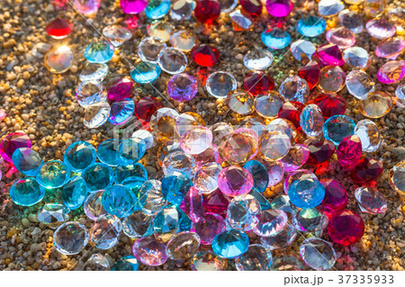 colorful gemstones on the beach 37335933