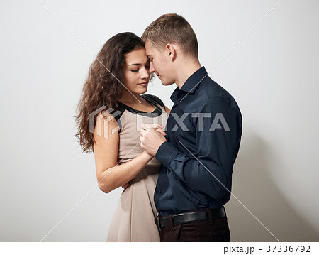 romantic couple posing on white background  37336792