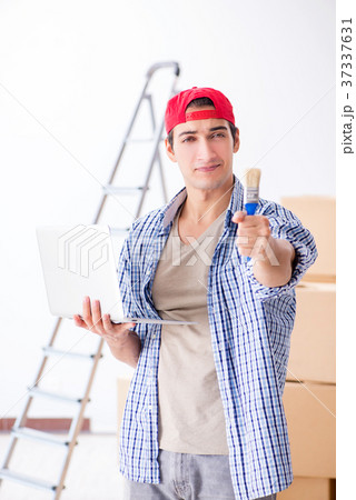 Young painter contractor choosing colors for home Young painter contractor choosing colors for home 37337631