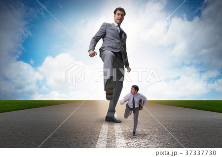 Bad angry boss kicking employee in business Bad angry boss kicking employee in business 37337730
