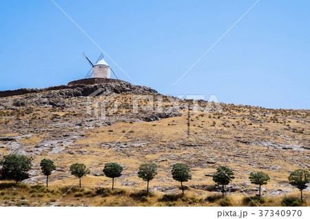 Beautiful and old windmills painted in white 37340970