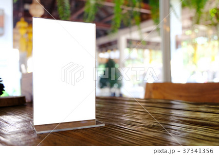 Mock up Menu frame standing on wood table in Mock up Menu frame standing on wood table in 37341356