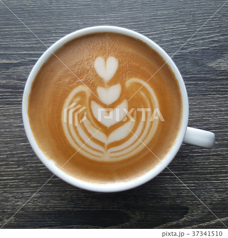 Top view of a mug of latte art coffee. 37341510