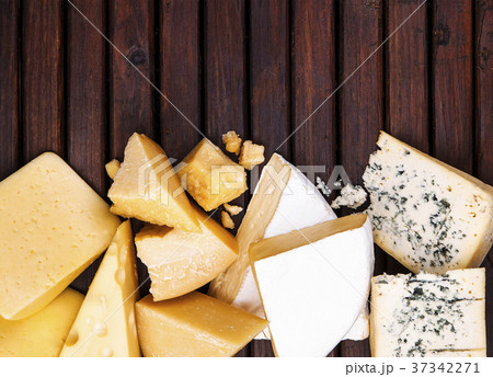 Various types of cheese on wooden table, top view 37342271