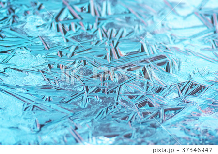 The texture of the frozen blue ice, closeup 37346947
