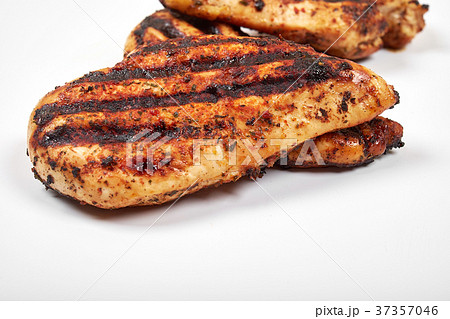 Chicken meat. Grilled fillet pieces isolated on Chicken meat. Grilled fillet pieces isolated on 37357046