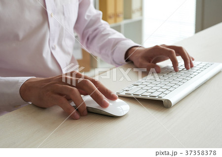 Busy with work on computer 37358378