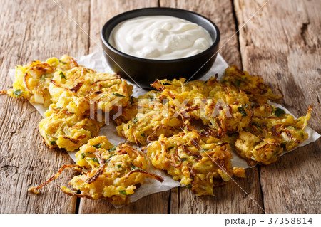 Homemade Indian fried onion bhaji with yogurt Homemade Indian fried onion bhaji with yogurt 37358814