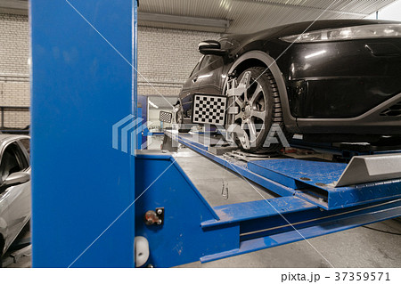 Grid sensor sets mechanic on auto. Car stand with Grid sensor sets mechanic on auto. Car stand with 37359571