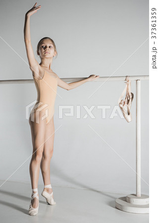 The girl is training near the ballet barre. The girl is training near the ballet barre. 37361359