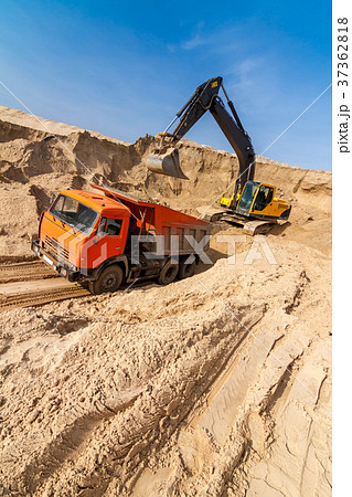 Excavator Loading Dumper Truck at sunny day Excavator Loading Dumper Truck at sunny day 37362818
