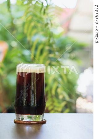 Coffee Nitro Cold Brew on table outdoor cafe Coffee Nitro Cold Brew on table outdoor cafe 37363352