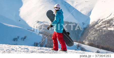 Young woman with snowboard Young woman with snowboard 37364161
