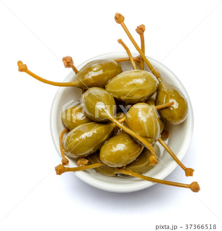heap of marinated capers on white background heap of marinated capers on white background 37366518