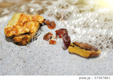 Amber. the pieces of amber in the sand on the Amber. the pieces of amber in the sand on the 37367861