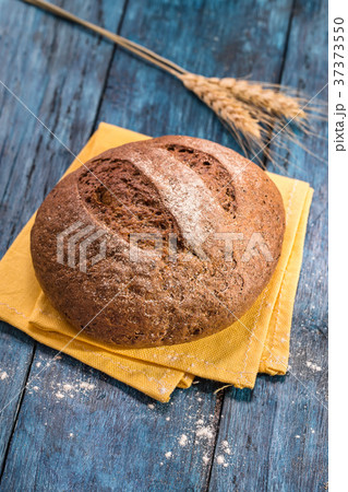 Rye bread on blue table 37373550
