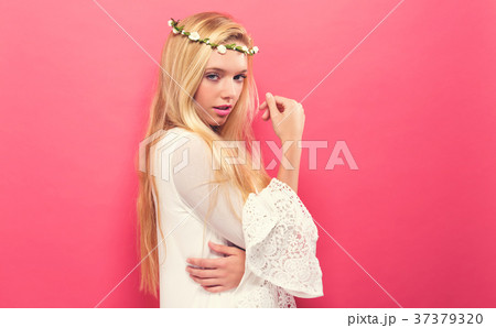 Beautiful young woman with a garland Beautiful young woman with a garland 37379320