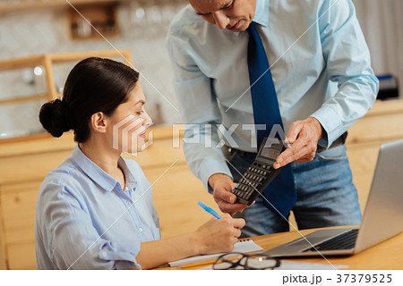 Pretty diligent employee sitting and looking at 37379525