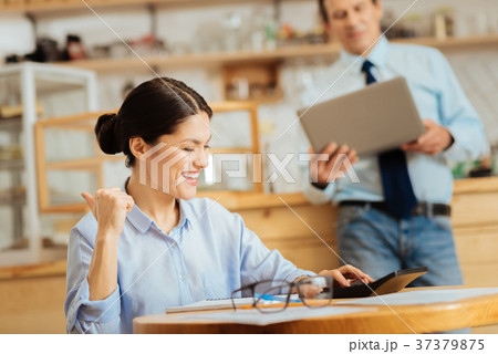 Funny cute woman calculating and laughing. 37379875