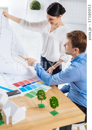 Happy woman showing her project and hearing good 37380953