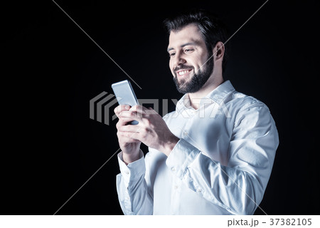 Happy cheerful man sending a message Happy cheerful man sending a message 37382105