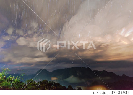 Startrail with Mountain view, foggy environment Startrail with Mountain view, foggy environment 37383935