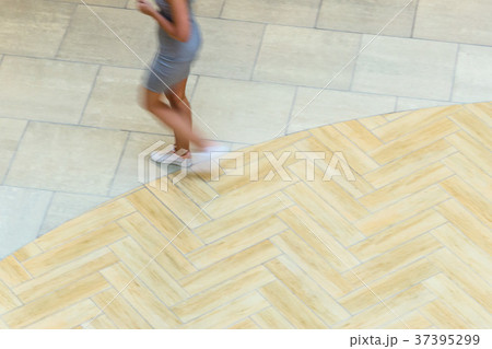 Blur in motion figure of a young woman Blur in motion figure of a young woman 37395299