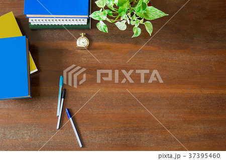 Messy office supplies on wooden table Messy office supplies on wooden table 37395460