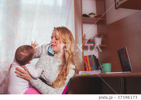 Freelance worked mom with baby 37396173