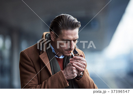 Serious male taking fire outside 37396547