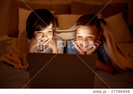 Two happy youngsters watching movie 37396898