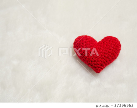handmade red yarn heart on white wool.red heart 37396962