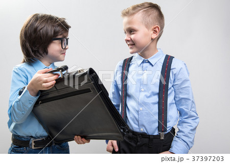 Schoolboys dreaming of being businessmen 37397203